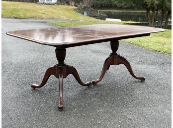 A Vintage Banded Mahogany Extendable Spindle Base Dining Table