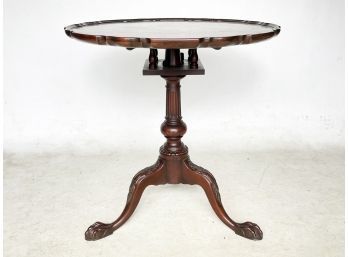 A Scalloped Edged Mahogany Rotating Top Occasional Table By Irwin Furniture