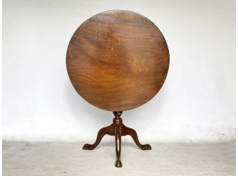 An Antique Mahogany Tilt Top Occasional Table