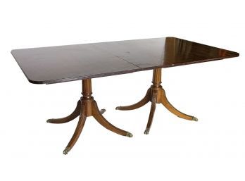 A Vintage Extendable Mahogany Pedestal Base Dining Table