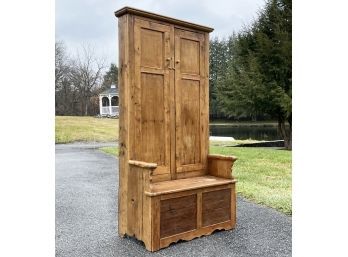 A 19th Century Pine Settle With Cabinet Above