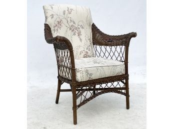 A Vintage Wicker Chair With Modern Cushions