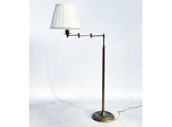 A Vintage Brass Reticulating Arm Standing Lamp