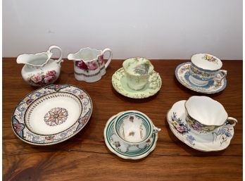 Four Tea Cups And Saucers Two Creamers And Small Bowl