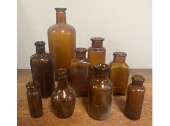 Lot Of 9 Antique Brown Glass Apothecary/ Drug Store Bottles. 1 Lysol, 1 Bell-Ans, 2 Made By Owens Illinois