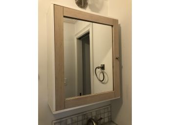 A Wall Mount Mirrored Medicine Cabinet