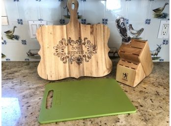 A Pair Of Cutting Boards And A Knife Block With Sharpener