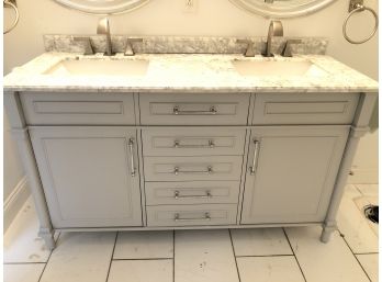 A Double Sink Vanity In Gray With Granite Counter And Under Mount Sinks