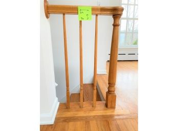 A Wood Railing With 3 Spindles And Newel Post