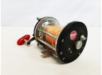 Vintage Olympic Dolphin Bait Cast Fishing Reel With Red Bakelite Handle - Made In Japan