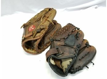 Two Baseball Gloves One Rawlings, One Wilson