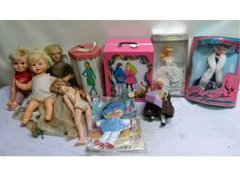 Group Of Baby Dolls And Barbies