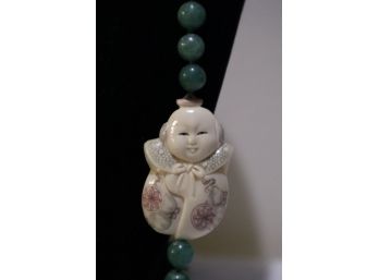 Jade Beaded Necklace With Carved Man