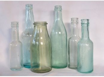 A Grouping Of Colorful  Old Bottles - Great For Decorating Or Window Display