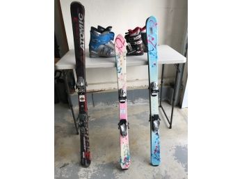 Collection Of Snow Skis, Boots And Poles