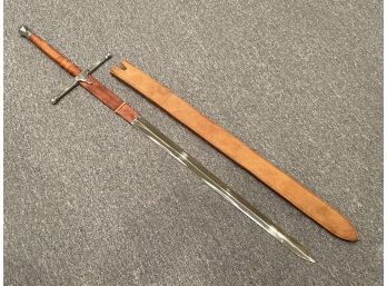 A Large Pakistani Stainless Steel Sword With Leather Hilt And Scabbard
