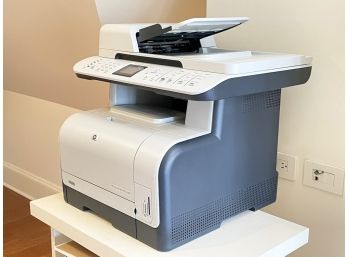 An HP Color Laserjet And Assorted Accessories