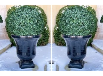 A Pair Of Composite Planters With Faux Boxwood Greenery