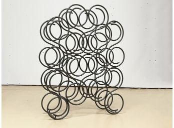 A Wrought Iron Wine Rack