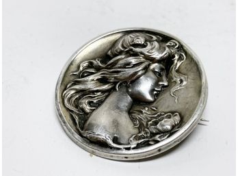 An Antique Sterling Silver Pin