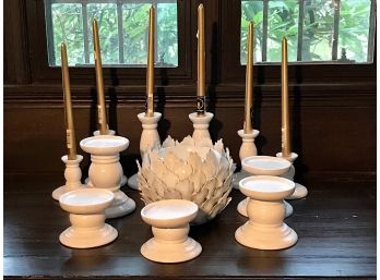 Assortment Of White Candle Holders And Candles