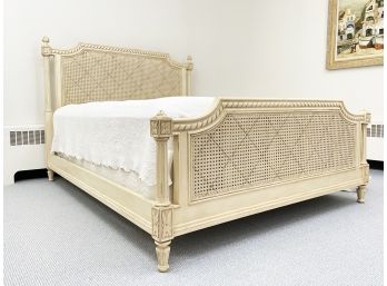 A French Provincial Queen Bedstead With Inset Cane Panels By Ethan Allen