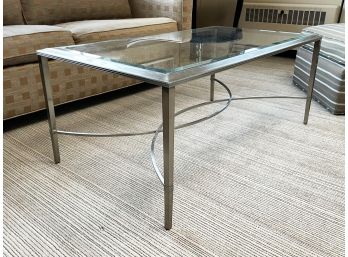 A Modern Streamlined Brushed Steel And Glass Top Coffee Table