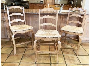 A Trio Of Rush Seated Counter Height Bar Stools In French Provincial Style