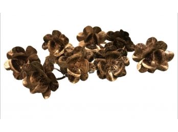 Eight Gold Toned Flower Napkin Rings