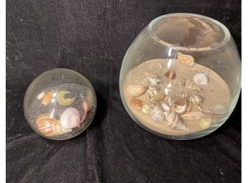 Black Sand Seashell Globe And A Fishbowl With Sand And Shells