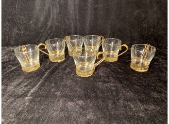 Seven Glass Teacups With Brass Handles