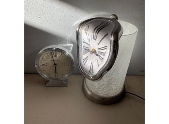 Two Battery Clocks And A Table Lamp