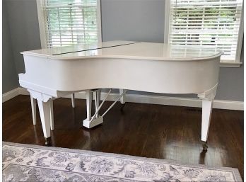 White Baby Grand Piano And Bench