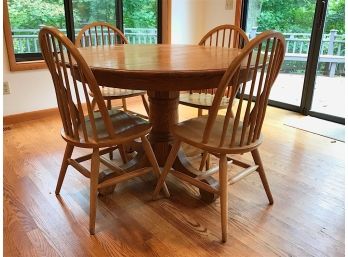 Light Oak Round Table And Four Windsor Style Chairs