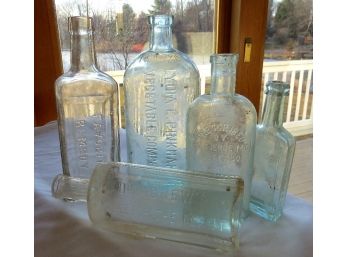A Grouping Of Embossed Medicine Bottles - Lot A