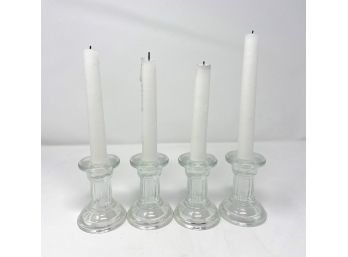 Four Glass Candlesticks