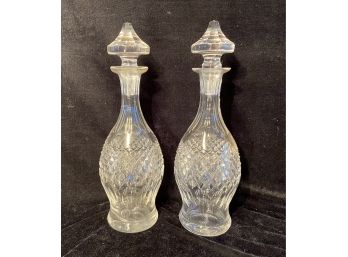 Two Tall Cut Glass Stoppered Glass Bottles