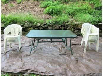 Glass Top Outdoor Table With 12 Plastic Chairs