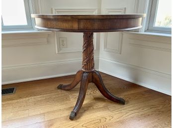 Pedestal Drum Table W Splayed Legs And Capped Feet