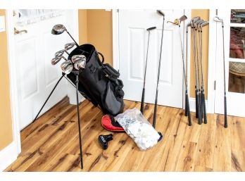 A Collection Of Golf Clubs With Sports Golf Bag