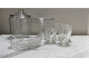 A Mixed Lot Of Glass Items - Glass Cake Stand, Glasses, Canister With Lid And More