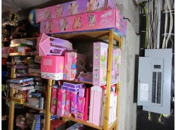 Three Shelves Of Barbie Collectibles