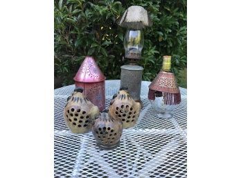 Assorted Candle Holders And A Lamp