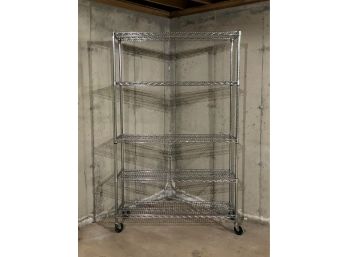 A Five-Tier Heavy Duty Chrome Wire Shelving Unit On Industrial Caster Wheels