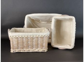 Three White-Washed Wicker Baskets With Fabric Liners