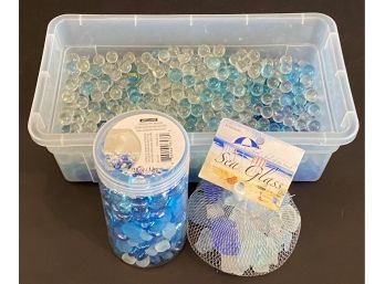A Small Plastic Tote Full Of Glass Floral Beads & Sea Glass