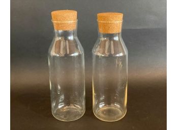 A Pair Of Contemporary Glass Bottles With Cork Stoppers