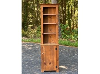 A Rustic, Handcrafted Pine Bookcase With Lower Cabinet