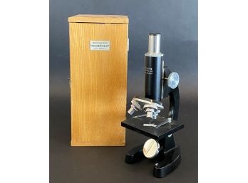 A Vintage Microscope In A Wooden Case