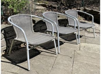 A Trio Of Modern Metal And Mesh Outdoor Arm Chairs